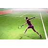 Pretty young woman playing tennis at playground. Mixed media