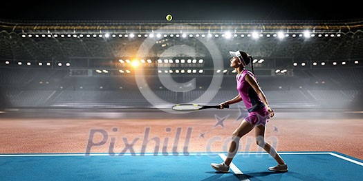 Pretty young woman playing tennis at playground. Mixed media Pretty young woman playing tennis at playground. Mixed media