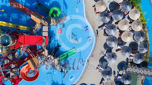 colorful water park aquapark water splash aerial top view of happy unidentified people and kids having fun and get relaxed colorful water park aquapark water splash aerial top view of happy unidentified people and kids having fun and get relaxed