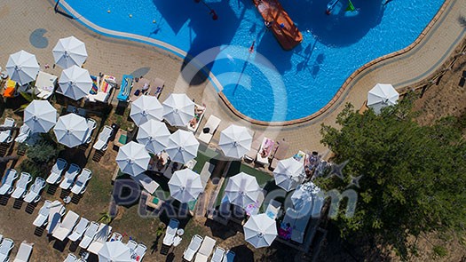 colorful water park aquapark water splash aerial top view of happy unidentified people and kids having fun and get relaxed colorful water park aquapark water splash aerial top view of happy unidentified people and kids having fun and get relaxed