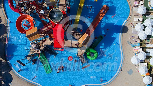 colorful water park aquapark water splash aerial top view of happy unidentified people and kids having fun and get relaxed colorful water park aquapark water splash aerial top view of happy unidentified people and kids having fun and get relaxed