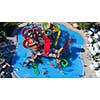 colorful water park aquapark water splash aerial top view of happy unidentified people and kids having fun and get relaxed