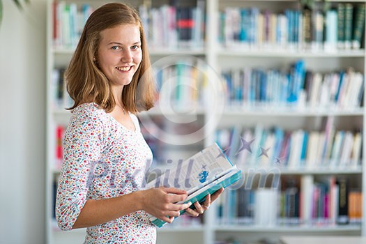 Cute female university/highschool student with books in library Cute female university/highschool student with books in library
