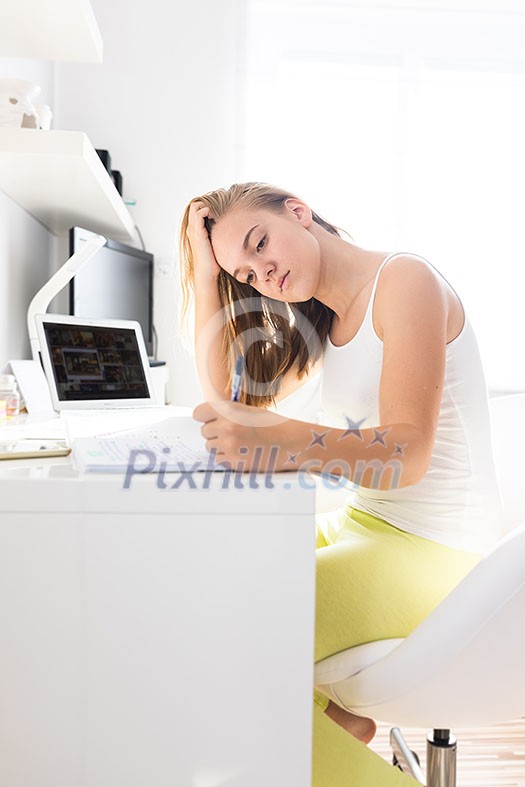Teenage girl studing for school, doing homework on a sunny Sunday morning in a lovely, bright room Teenage girl studing for school, doing homework on a sunny Sunday morning in a lovely, bright room