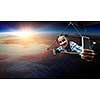 Selfie shot of brave hang glider pilot soaring with book in hands. Mixed media