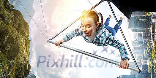 Brave hang glider pilot soaring high in sky. Mixed media Brave hang glider pilot soaring high in sky. Mixed media