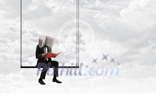 Unrecognizable man with book instead of his head. Mixed media Unrecognizable man with book instead of his head. Mixed media