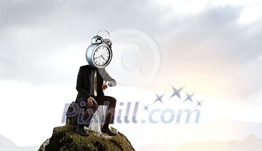 Businessman with alarm clock instead of his head. Mixed media Businessman with alarm clock instead of his head. Mixed media