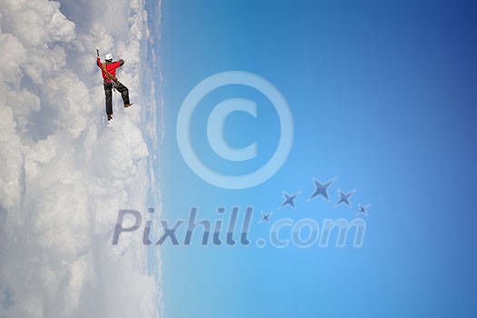 Alpinist man climbing white cloud high in sky. Mixed media Alpinist man climbing white cloud high in sky. Mixed media