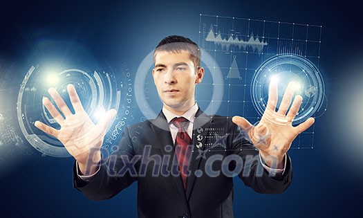 Portrait of businessman working with virtual panel interface. Mixed media