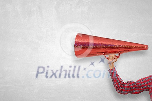 Close of woman making announcement in paper red trumpet Close of woman making announcement in paper red trumpet