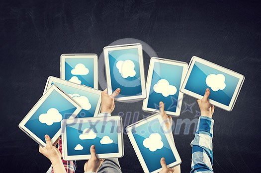 Close of businessman hands holding tablet with arrow on screen Close of businessman hands holding tablet with arrow on screen
