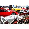 Old cars auction - People viewing cars on sale during an expensive old cars  auction