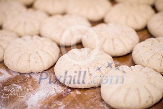 balls of dough bread getting ready to be baked at professional bakery balls of dough bread getting ready to be baked at professional bakery