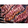 Assorted delicious grilled meat over the coals on barbecue