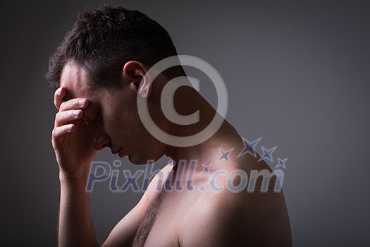 Depressed young man going through a rough patch in his life - suffering from mental exhaustion/anxiety/burnout/depression (color toned image) Depressed young man going through a rough patch in his life - suffering from mental exhaustion/anxiety/burnout/depression (color toned image)