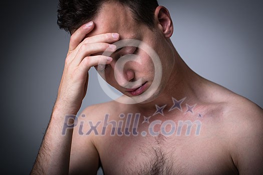 Depressed young man going through a rough patch in his life - suffering from mental exhaustion/anxiety/burnout/depression (color toned image) Depressed young man going through a rough patch in his life - suffering from mental exhaustion/anxiety/burnout/depression (color toned image)