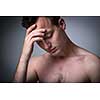 Depressed young man going through a rough patch in his life - suffering from mental exhaustion/anxiety/burnout/depression (color toned image)