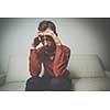 Depressed young man going through a rough patch in his life - suffering from mental exhaustion/anxiety/burnout/depression (color toned image)