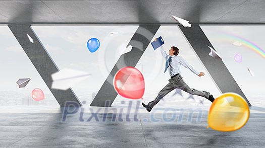 Young dancing businessman in suit in modern interior Young dancing businessman in suit in modern interior