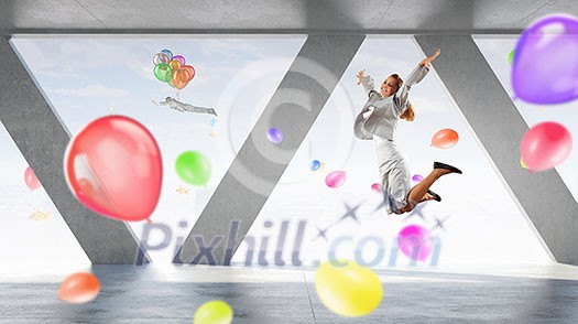 Young dancing businesswoman in suit in modern interior Young dancing businesswoman in suit in modern interior