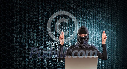 Hacker woman in dark clothes using laptop against digital background Hacker woman in dark clothes using laptop against digital background