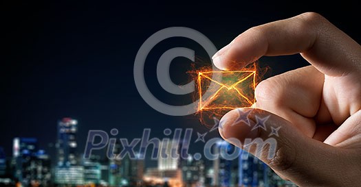 Close view of male hand taking email sign with fingers Close view of male hand taking email sign with fingers