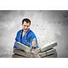 Determined karate man break with hand stone bricks