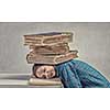 Student girl pressed with pile of books to table