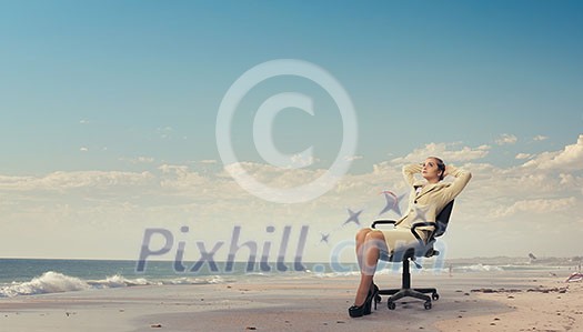 Young relaxed businesswoman sitting relaxed in chair and dreaming Young relaxed businesswoman sitting relaxed in chair and dreaming