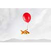 Concept of surrealism with gold fish flying on air balloon