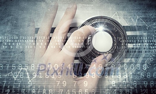 Hands of woman dialing numbers on safe padlock Hands of woman dialing numbers on safe padlock