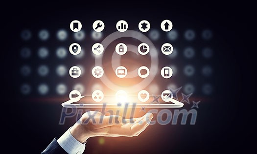 Hand of businessman holding touchpad pc presenting social network concept Hand of businessman holding touchpad pc presenting social network concept