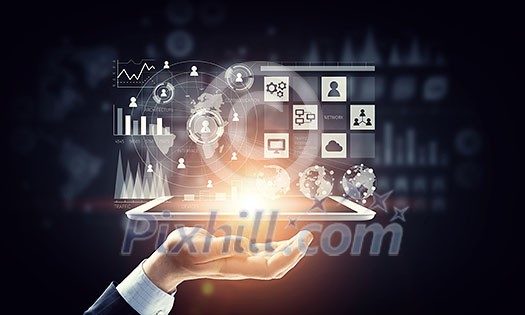Hand of businessman holding touchpad pc presenting social network concept Hand of businessman holding touchpad pc presenting social network concept