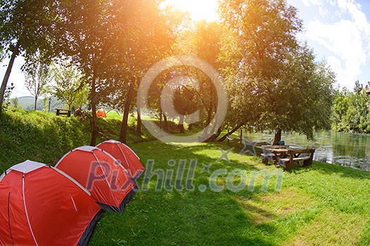 calm relaxing camp tent near the beautiful river on sunny summer day calm relaxing camp tent near the beautiful river on sunny summer day