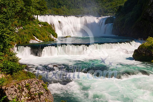 waterfall in beautiful nature with crystal clear water on wild river una in bosnia and herzegovina at sunny summer day waterfall in beautiful nature with crystal clear water on wild river una in bosnia and herzegovina at sunny summer day