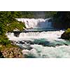 waterfall in beautiful nature with crystal clear water on wild river una in bosnia and herzegovina at sunny summer day