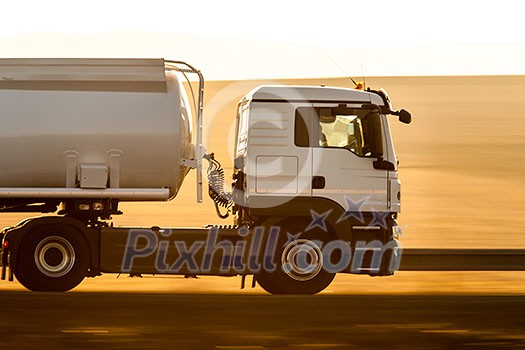 Truck passing by with panning effect on the road Truck passing by with panning effect on the road