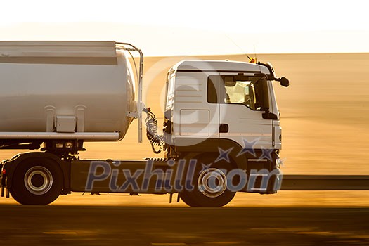 Truck passing by with panning effect on the road