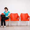 Pretty young female student with laptop on college/university campus