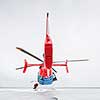 Modern medical helicopter on a hospital rooftop helipad from behind - shallow DOF