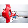 Modern medical helicopter on a hospital rooftop helipad from behind - shallow DOF