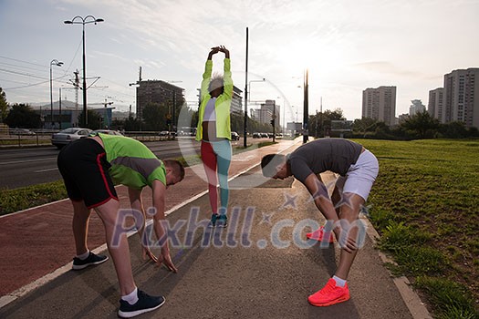multiethnic group of young people on the jogging beautiful morning as the sun rises in the streets of the city multiethnic group of young people on the jogging beautiful morning as the sun rises in the streets of the city