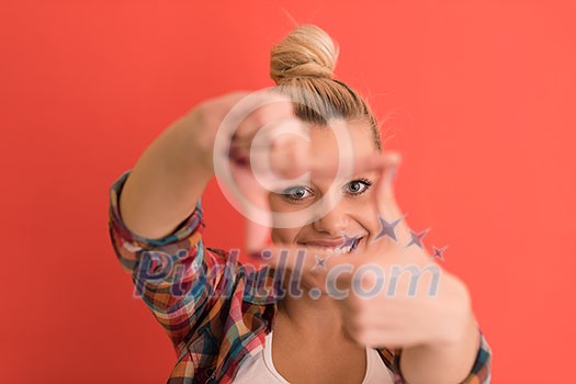 Portrait of a beautiful young woman with hair bun over color background with copyspace expressing different emotions Portrait of a beautiful young woman with hair bun over color background with copyspace expressing different emotions