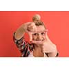 Portrait of a beautiful  young woman with hair bun over color background with copyspace expressing different emotions
