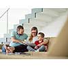 happy young family with little boy enjoys in the modern living room of their luxury home villa