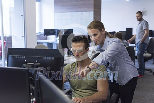 business couple working together on project at modern startup office business couple working together on project at modern startup office