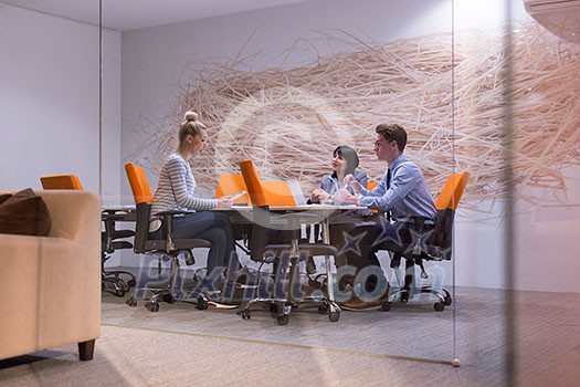 Group of business people discussing business plan in the office Group of business people discussing business plan in the office
