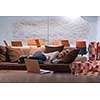 A young casual business woman sleeping on a sofa during a work break in a creative office