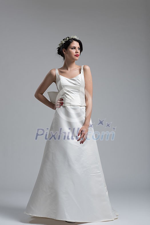 Portrait of beautiful young women in wedding dress isolated on a white background Portrait of beautiful young women in wedding dress isolated on a white background